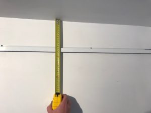At what height should I install my picture hanging system?